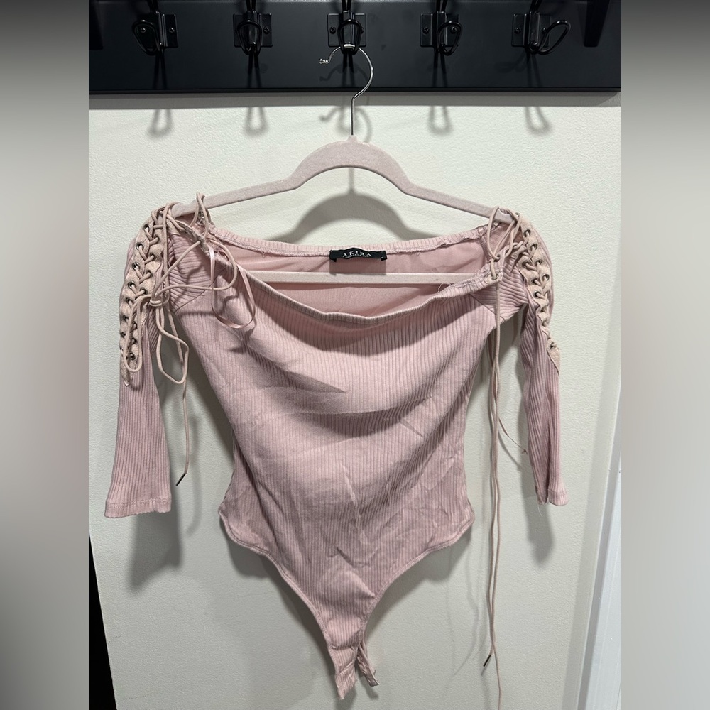 Light pink with ties on the arm top